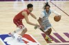 Cleveland Cavalier Darius Garland, right, tries to get around Phoenix Suns' Devin Booker during the first half of the NBA All-Star basketball game, Sunday, Feb. 20, 2022, in Cleveland. (AP Photo/Ron Schwane)