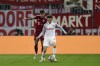 Bayern's Lucas Hernandez, left, duels for the ball with Salzburg's Brenden Aaronson during the Champions League, round of 16, first leg soccer match between Salzburg and Bayern, at the Salzburg stadium, in Salzburg, Austria, Wednesday, Feb. 16, 2022. (AP Photo/Alexandra Beier)