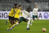 Moenchengladbach's Manu Kone, right, and Dortmund's Dan-Axel Zagadou challenge for the ball during the German Bundesliga soccer match between Borussia Dortmund and Borussia Moenchengladbach in Dortmund, Germany, Sunday, Feb. 20, 2022. (AP Photo/Martin Meissner)