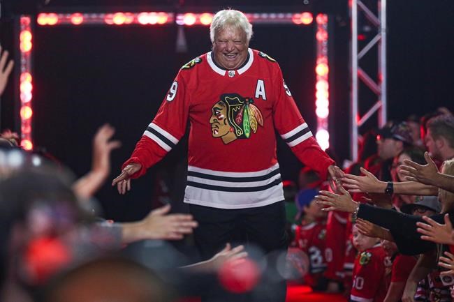 FILE - Former Chicago Blackhawks player Bobby Hull is introduced to fans during the NHL hockey team's convention in Chicago, Friday, July 26, 2019. Hall of Fame forward Bobby Hull is no longer serving as a team ambassador for the Chicago Blackhawks.