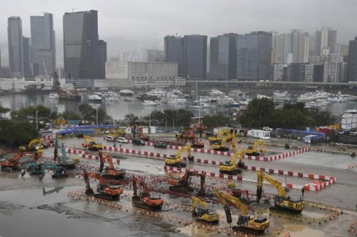 A general view shows a construction site building facilities for isolating the COVID-19 patients in Kai Tak Cruise Terminal in Hong Kong, Tuesday, Feb. 22, 2022. Hong Kong will test its entire population for COVID-19 in March, the city’s leader said Tuesday, as the city grapples with its worst outbreak driven by the omicron variant.(AP Photo/Kin Cheung)