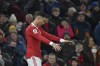 Manchester United's Cristiano Ronaldo celebrates scoring his side's first goal during the English Premier League soccer match between Manchester United and Brighton & Hove Albion at Old Trafford stadium, in Manchester, England, Tuesday, Feb. 15, 2022. (AP Photo/Rui Vieira)