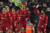 Liverpool's Mohamed Salah, right, celebrates after scores his second goal against Leeds United during the English Premier League soccer match between Liverpool and Leeds United at Anfield stadium in Liverpool, England, Wednesday, Feb. 23, 2022. (AP Photo/Jon Super)