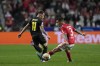 Benfica's Alex Grimaldo, right, is challenged by Ajax's Antony during the Champions League round of 16, first leg, soccer match between Benfica and Ajax at the Luz stadium in Lisbon, Wednesday, Feb. 23, 2022. (AP Photo/Armando Franca)