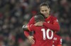 Liverpool's Sadio Mane, front, celebrates his goal with his teammate Virgil van Dijk, against Leeds United during the English Premier League soccer match between Liverpool and Leeds United at Anfield stadium in Liverpool, England, Wednesday, Feb. 23, 2022. (AP Photo/Jon Super)