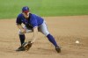 FILE - Texas Rangers infielder Josh Jung reaches down to field a ground ball in an intrasquad game during baseball practice at Globe Life Field in Arlington, Texas, Friday, July 10, 2020. Texas Rangers top prospect Josh Jung had surgery Wednesday, Feb. 23, 2022 to repair a torn labrum in his left shoulder, ending the third baseman's chance of being an option for the big league roster this spring.(AP Photo/Tony Gutierrez, File)
