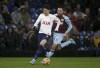 Tottenham Hotspur's Son Heung-min, left, and Burnley's Dwight McNeil battle for the ball during the English Premier League soccer match at Turf Moor, Burnley, England, Wednesday Feb. 23, 2022. (Ian Hodgson/PA via AP)