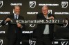 FILE - MLS Commissioner Don Garber, left, and Charlotte MLS owner David Tepper announce that Major League Soccer will be coming to Charlotte in 2021 at an event in Charlotte, N.C., Tuesday, Dec. 17, 2019. Expansion Charlotte FC opens its inaugural season on Saturday, Feb. 26, 2022, against D.C. United at Audi Field.(AP Photo/Nell Redmond, File)