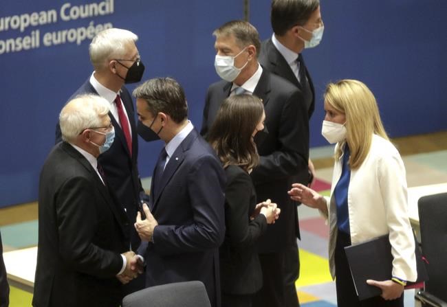 From left, European Union foreign policy chief Josep Borrell, Latvia's Prime Minister Krisjanis Karins, Greek Prime Minister Kyriakos Mitsotakis, Finland's Prime Minister Sanna Marin, Romania's President Klaus Werner Ioannis and Dutch Prime Minister Mark Rutte during a round table meeting at an extraordinary EU summit on Ukraine at the European Council building in Brussels, Thursday, Feb 24, 2022. Russia launched a wide ranging attack on Ukraine on Thursday, hitting cities and bases with airstrikes or shelling, as civilians piled into trains and cars to flee. (Olivier Hoslet, Pool Photo via AP)