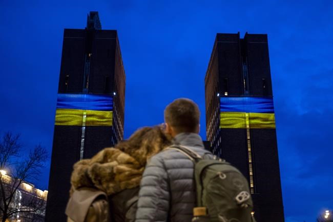 Oslo City Hall was illuminated with the colors of the Ukrainian flag, in Oslo, Norway, Thursday night, Feb. 24, 2022. The celebration is intended as a symbolic act in solidarity with Ukraine. (Javad Parsa/NTB via AP)