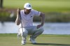 Daniel Berger lines up a putt on the 15th green during the second round of the Honda Classic golf tournament, Friday, Feb. 25, 2022, in Palm Beach Gardens, Fla. (AP Photo/Lynne Sladky)