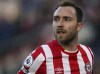 Brentford's Christian Eriksen in action, during the English Premier League soccer match between Brentford and Newcastle United at the Brentford Community Stadium, London, Saturday Feb. 26, 2022. (Aaron Chown/PA via AP)