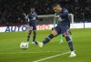 PSG's Kylian Mbappe scores his side's third goal during the French League One soccer match between Paris Saint Germain and Saint-Etienne at the Parc des Princes stadium in Paris, Saturday, Feb. 26, 2022. (AP Photo/Michel Euler)