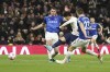 Tottenham's Son Heung-min, centre, scores his team's second goal during the English Premier League soccer match between Tottenham Hotspur and Everton at Tottenham Hotspur Stadium in London, Monday, March 7, 2022. (AP Photo/Ian Walton)