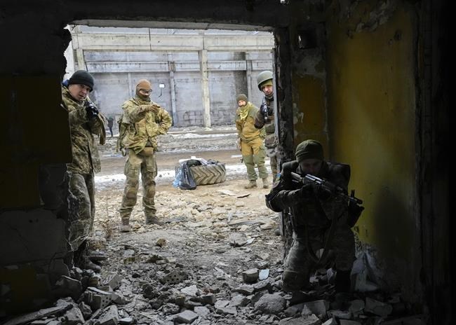 Belarusian volunteers receive military training at the Belarusian Company base in Kyiv, Ukraine, Tuesday, March 8, 2022. Hundreds of Belarus' emigrants and citizens have arrived in Ukraine to help the Ukrainian army fight against Russian invaders. (AP Photo/Efrem Lukatsky)