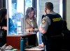 Lisa Banfield, spouse of Gabriel Wortman, puts on a mask at Nova Scotia provincial court in Dartmouth on Wednesday, March 9, 2022. Banfield's lawyer withdrew her not guilty plea to charges related to illegally transferring ammunition to Wortman, responsible for the mass murders in rural Nova Scotia on April 18-19, 2020. The case will be referred to restorative justice. THE CANADIAN PRESS/Andrew Vaughan