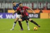 AC Milan's Olivier Giroud, right, challenges for the ball with Inter Milan's Stefan de Vrij during an Italian Cup semifinal, first leg, soccer match between AC Milan and Inter Milan at the San Siro stadium, in Milan, Italy, Tuesday, March 1, 2022. (AP Photo/Antonio Calanni)