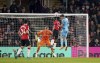 Newcastle United's Chris Wood, right, scores during the English Premier League soccer match between Southampton and Newcastle United at St Mary's Stadium, London, Thursday March 10, 2022. (Adam Davy/PA via AP)