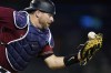 FILE - Arizona Diamondbacks catcher Stephen Vogt is unable to make the catch on a foul ball hit by San Francisco Giants' Steven Duggar during the eighth inning of a baseball game July 2, 2021, in Phoenix. Vogt ended last season injured and became a minor league free agent. He probably could have signed months ago given a half-dozen teams expressed interest. Instead, the veteran catcher stuck by his big league brotherhood. Now, Vogt, like so many others, waits for what's next in the coming days and weeks after the end of a 99-day work stoppage Thursday, March 10. (AP Photo/Ross D. Franklin, File)