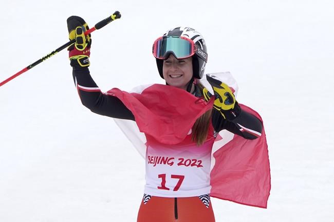 Mollie Jepsen of Canada celebrates after competing in the women's giant slalom, standing at the 2022 Winter Paralympics, Friday, March 11, 2022, in the Yanqing district of Beijing. (AP Photo/Andy Wong)