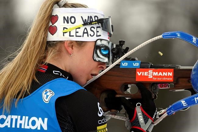 Ingrid Landmark Tandrevold of Norway sports a headband reading No War Please as she competes in the Biathlon 4x6 km relay women's World Cup competition, in Kontiolahti, Finland, Thursday, March 3, 2022. (Vesa Moilanen/Lehtikuva via AP)