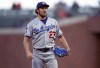 FILE - Los Angeles Dodgers starting pitcher Trevor Bauer looks toward home during the fourth inning of the the team's baseball game against the San Francisco Giants on May 21, 2021, in San Francisco. Bauer's administrative leave was extended Friday, March 11, 2022, for a week by Major League Baseball and the players' association. (AP Photo/D. Ross Cameron, File)
