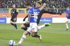 Sampdoria's Francesco Caputo, foreground, vies for the ball with Juventus' Manuel Locatelli, during the Serie A soccer match between Sampdoria and Juventus, at Luigi Ferraris Stadium, in Genoa, Italy, Saturday, March 12, 2022. (Tano Pecoraro, LaPresse via AP)