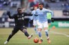 New York City FC forward Valentín Castellanos, right, tries to avoid the challenge from CF Montreal defender Zachary Brault-Guillard (15) battle for the ball during the second half of an MLS soccer match at Yankee Stadium, Saturday, March 12, 2022, in New York. (AP Photo/Eduardo Munoz Alvarez)