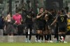 Los Angeles FC players celebrate their side's second goal against Inter Miami, scored by Los Angeles FC forward Ismael Tajouri-Shradi, obscured center, during an MLS soccer match, Saturday, March 12, 2022, in Fort Lauderdale, Fla. Los Angeles FC defeated Inter Miami 2-0. (AP Photo/Rebecca Blackwell)