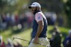 Dustin Johnson reacts as he misses a putt on the third hole during the second round of play in The Players Championship golf tournament Saturday, March 12, 2022, in Ponte Vedra Beach, Fla. (AP Photo/Gerald Herbert)