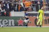Vancouver Whitecaps forward Lucas Cavallini, left, follows the ball into the goal on his score past Houston Dynamo goalkeeper Steve Clark, right, during the first half of an MLS soccer match Saturday, March 12, 2022, in Houston. (AP Photo/Michael Wyke)