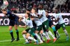 Gladbach's Jordan Beyer 2nd from left, and Hertha's Niklas Stark, left, fight for the ball , during the German Bundesliga soccer match between Borussia Monchengladbach and Hertha BSC, in Monchengladbach, Germany, Saturday, March 12, 2022. (Federico Gambarini/dpa via AP)