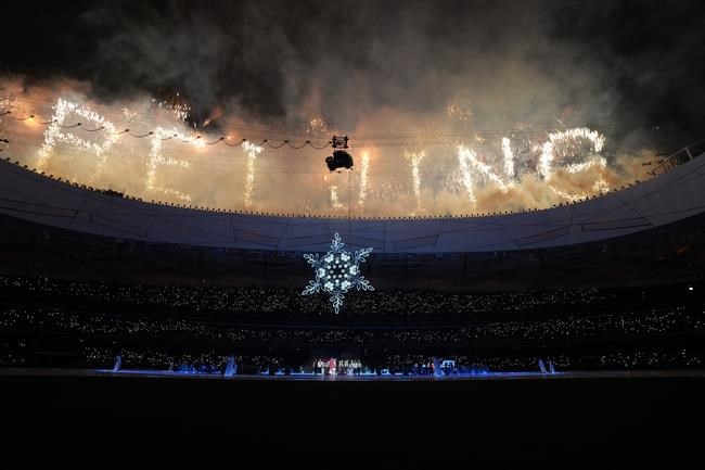 Fireworks ignite during the closing ceremony at the 2022 Winter Paralympics, Sunday, March 13, 2022, in Beijing. (AP Photo/Shuji Kajiyama)