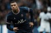 PSG's Kylian Mbappe celebrates after scoring his side's first goal during the French League One soccer match between Paris Saint-Germain and Bordeaux at the Parc des Princes stadium in Paris, France, Sunday, March 13, 2022. (AP Photo/Thibault Camus)
