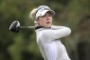 FILE - Nelly Korda tees off on the ninth hole during the final round of the Tournament of Champions LPGA golf tournament, Sunday, Jan. 23, 2022, in Orlando, Fla. Top-ranked American and Olympic gold medalist Nelly Korda has a blood clot in her arm and is home seeking treatment. Korda, the No. 2 player in the women's world ranking, posted on her social media accounts that she was in Ponte Vedra Beach on Friday, March 11, 2022, for a commercial shoot when her arm felt as though it were swelling following a routine morning workout. She went to the emergency room as a precaution and was diagnosed with a blood clot. (AP Photo/Phelan M. Ebenhack, File)