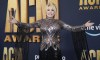 Dolly Parton arrives at the 57th Academy of Country Music Awards on Monday, March 7, 2022, at Allegiant Stadium in Las Vegas. (AP Photo/Eric Jamison)