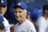 FILE - Los Angeles Dodgers Hall of Fame pitcher Sandy Koufax, on hand for the Dodgers' Old Timers Game festivities, smiles as he talks to current members of the team in the dugout before the baseball game between the Los Angeles Dodgers and Colorado Rockies, Saturday, May 16, 2015, in Los Angeles. On Monday, March 14, 2022, the Los Angeles Dodgers announced that Koufax is joining fellow Hall of Famer Jackie Robinson with a bronze statue of his own at Dodger Stadium, with an unveiling planned for June 18, 2022, before the team hosts Cleveland. (AP Photo/Danny Moloshok, File)