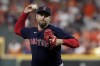 FILE - Boston Red Sox relief pitcher Adam Ottavino throws against the Houston Astros during the eighth inning in Game 6 of baseball's American League Championship Series, Oct. 22, 2021, in Houston. The busy New York Mets added an experienced arm to their bullpen Monday, March 14, 2022, signing Ottavino to a $4 million, one-year contract. The veteran right-hander can earn another $1 million in performance bonuses. (AP Photo/Tony Gutierrez, File)