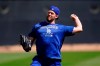 Los Angeles Dodgers pitcher Clayton Kershaw warms up during a spring training baseball workout Sunday, March 13, 2022, in Phoenix. (AP Photo/Ross D. Franklin)