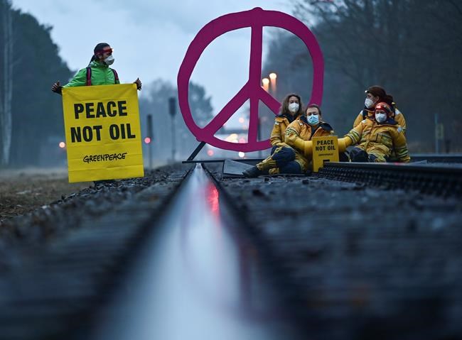 Early this morning, activists from Greenpeace block a rail track leading to the oil refinery in Schwedt, Germany, Tuesday, March 15, 2022. With this action, Greenpeace protests against fossil imports from Russia and the indirect financing of the war in Ukraine. Crude oil from Russia arrives at the PCK oil refinery in Schwedt via the
