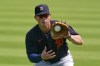 FILE - Detroit Tigers' Spencer Torkelson warms up before the team's spring training baseball game against the Pittsburgh Pirates in Bradenton, Fla., Tuesday, March 2, 2021. Baltimore Orioles catcher Adley Rutschman, Kansas City Royals shortstop Bobby Witt Jr. and Detroit Tigers infielder Spencer Torkelson are among baseball's most intriguing rookies this summer. (AP Photo/Gene J. Puskar, File)