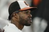 FILE - Baltimore Orioles center fielder Cedric Mullins looks on from the dugout after robbing a two-run home run off New York Yankees' Gary Sanchez during the second inning of a baseball game, Wednesday, Sept. 15, 2021, in Baltimore. Mullins’ outstanding 2021 statistics for the Orioles appear even more impressive after learning of the compounding offseason surgery he had to overcome. (AP Photo/Julio Cortez, File)