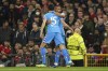 Atletico Madrid's Renan Lodi is congratulated by teammate Stefan Savic, left, after scoring his team's first goal during the Champions League round of 16, second leg soccer match between Manchester United and Atletico Madrid at Old Trafford, Manchester, England, Tuesday, March 15, 2022. (AP Photo/Dave Thompson)