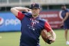 Minnesota Twins pitcher Sonny Gray warm ups during baseball spring training at Hammond Stadium Tuesday March 15, 2022, in Fort Myers, Fla. (AP Photo/Steve Helber)