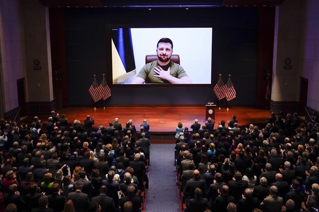 Ukrainian President Volodymyr Zelenskyy speaks to the U.S. Congress by video to plead for support as his country is besieged by Russian forces, at the Capitol in Washington, Wednesday, March 16, 2022. (AP Photo/J. Scott Applewhite, Pool)