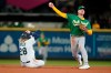 Oakland Athletics second baseman Matt Chapman, right, throws to first after forcing Seattle Mariners' Jake Fraley (28) at second during the fifth inning of a baseball game in Seattle, Wednesday, Sept. 29, 2021. THE CANADIAN PRESS/AP-Ted S. Warren