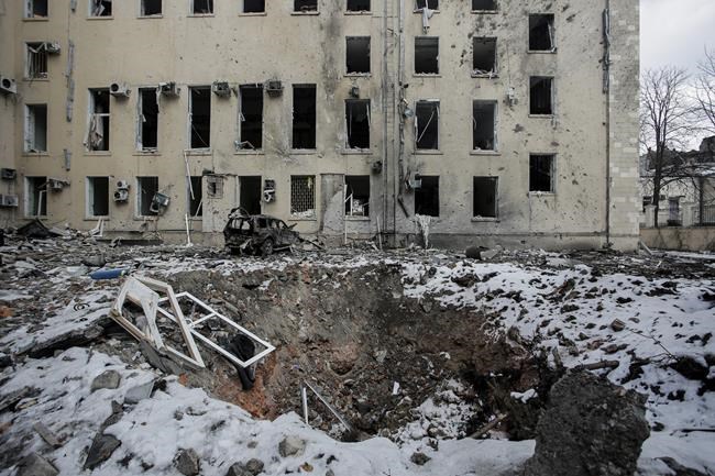 A view of a bomb crater after Russian shelling in the central of Kharkiv, Ukraine, Wednesday, March 16, 2022. (AP Photo/Pavel Dorogoy)