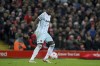West Ham's Kurt Zouma takes control of the ball during the English Premier League soccer match between Liverpool and West Ham United at Anfield stadium in Liverpool, England, Saturday, March 5, 2022. (AP Photo/Jon Super)