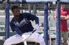 Atlanta Braves outfielder Ronald Acuna Jr. eyes a bunt during spring training batting practice at the CoolToday Park, Monday, March 14, 2022, in North Port, Fla. (AP Photo/Steve Helber)