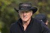 FILE - Greg Norman walks on the first hole after hitting his tee shot during the final round of the PNC Championship golf tournament, Sunday, Dec. 20, 2020, in Orlando, Fla. Norman has had his share of rough Sundays in major championships. He had another one without a club in his hand. Norman's hopes for a Saudi-financed golf league took one hit after another. (AP Photo/Phelan M. Ebenhack, File)